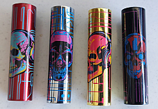 Clipper  4 x Micro  Refillable Lighters  collectable in metal skull cases